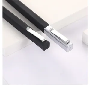 Close-up detail shot of square ballpoint pens featuring metal clips and sleek matte finish.