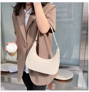 Chic white half moon shoulder bag for women, trendy underarm hobo bag for stylish daily outfit.