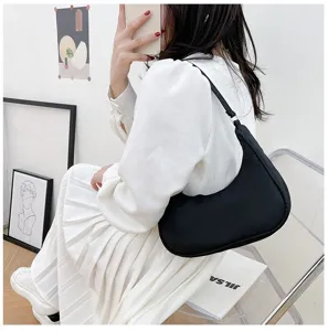 Stylish black nylon crescent shoulder bag for women, trendy underarm hobo handbag.