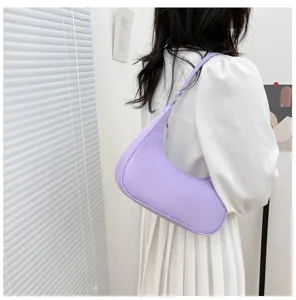 Minimalist purple crescent shoulder bag for women, chic hobo handbag for daily wear and travel.