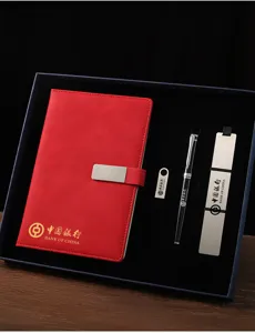 Coffret cadeau d'affaires avec carnet en cuir rouge, stylo métal, marque-page et clé USB.