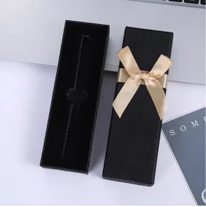 Caja de regalo negra con lazo dorado para bolígrafos y joyas, elegante caja de embalaje.