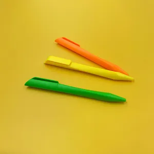 Closeup of colorful triangular matte ballpoint pens in orange, yellow and green set.