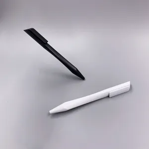 Close-up of creative triangular ballpoint pens in black and white matte plastic finish.