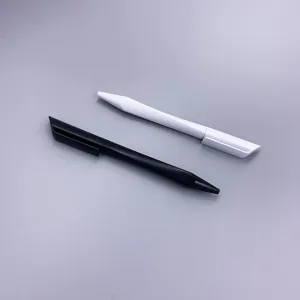 Close-up of matte plastic promotional ballpoint pens in black and white with triangular shape.