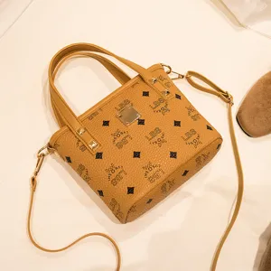 Klassische braune Eimer-Tasche modische Damen Schultertasche mit Retro Monogramm Muster.