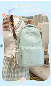 Lightweight student backpack with star print and large capacity for casual outdoor school use.
