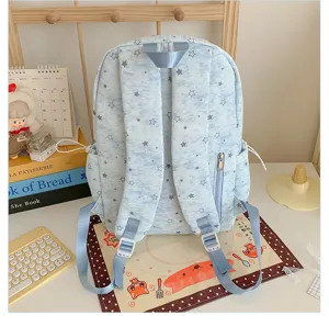 Cute light blue star pattern student backpack detail view with zipper pocket and strong straps.
