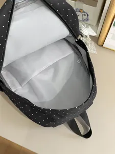 Cute black polka dot backpack for women, stylish school bag with large capacity for travel and daily.