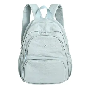 Casual light blue nylon backpack for women, daily commute school bag with multiple pockets.