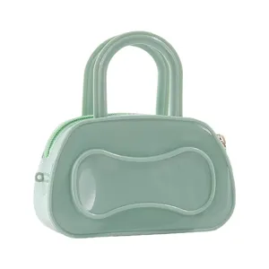 Green PVC jelly Boston bag detail shot, transparent glossy texture, double top handle design.