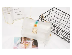 Transparent PVC jelly crossbody bag detail showcasing colorful pyramid studs and metal chain.