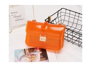 Orange transparent PVC shoulder bag for women, stylish messenger bag with chain.