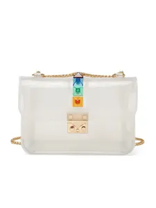 Transparent PVC crossbody shoulder bag with metal chain and colorful pyramid studs.