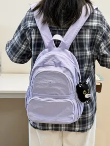 Light purple casual backpack for women, stylish daily school bag with spacious compartments.