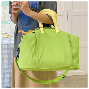 Large capacity expandable travel duffel bag with dry wet separation and shoulder straps.