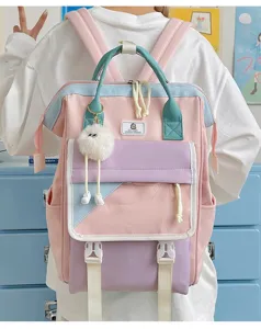 Detailed view of the cute multi-color casual backpack with plush pendant and front pockets.