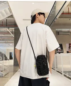 Outdoor tactical water bottle bag and phone shoulder pouch in black nylon, urban style.