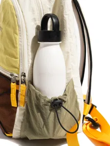 Colorful canvas backpack for women students, stylish color block travel daypack with side pocket.