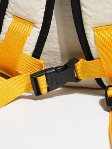 Color-blocking backpack detail showing durable straps and sturdy buckle for outdoor travel.