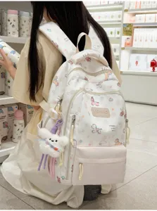 Ins-style fresh casual backpack for women, cute cartoon print school book bag for daily use.
