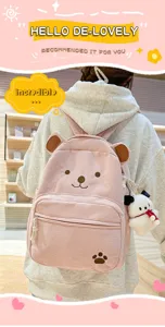 Cute corduroy cartoon bear backpack for women, stylish large capacity school bag for daily use.