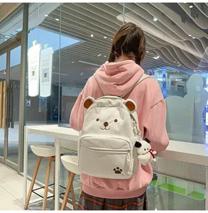 Detailed view of a cute corduroy backpack featuring bear ears and embroidery for daily casual use.
