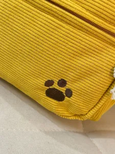 Yellow corduroy backpack with cute paw embroidery, casual daily campus bag for students.