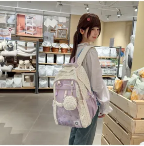 Cute polka dot school bag for girls, large capacity spine-protecting casual backpack.