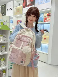 Cute polka dot backpack for school students, large capacity lightweight casual daypack.