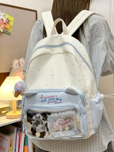 Cute large capacity white and blue ita bag backpack with transparent window for pins and badges.