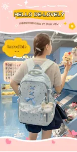 Mochila celeste bonita con estampado de estrellas, ribete de encaje y lazo para uso diario escolar