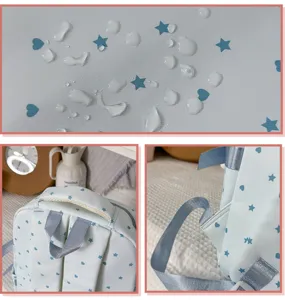 Bonita mochila escolar impermeable azul claro con patrón de estrellas y corazones para