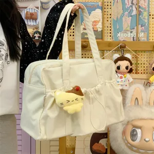 Casual canvas shoulder bag, large capacity commute travel tote with cute pendant for daily use.
