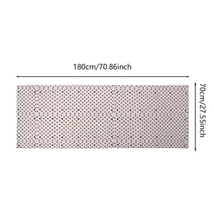Detail view of the soft polka dot scarf showing dimension measurements and fabric texture.