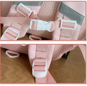 Children backpack strap detail view, cute pink school bag with adjustable buckles and mesh.