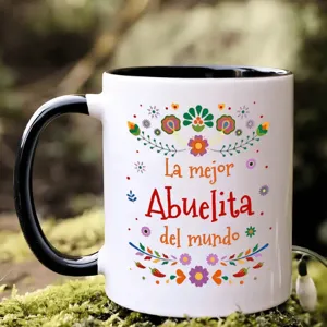 Keramik Kaffeetasse mit buntem Blumenmuster und spanischem Text, ideal für den Büroalltag.