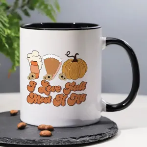 Nahaufnahme der Keramiktasse mit herbstlichem Grafikprint und schwarzem Griff für Büro und Alltag.