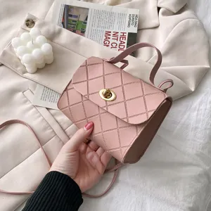 Pink quilted crossbody bag for women, trendy small shoulder handbag with top handle.