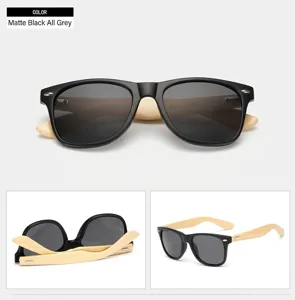 Detail view of classic black frame sunglasses with natural bamboo wooden temples and grey lenses.
