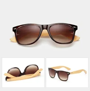 Detail view of stylish wooden temple sunglasses with gradient lenses, lightweight frame.