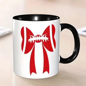 Κούπα καφέ κεραμική με κόκκινο σχέδιο φιόγκου και μαύρη λαβή, ιδανική για το γραφείο.