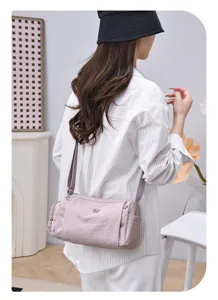 Stylish women's lightweight crossbody shoulder bag with multi-pockets for daily casual travel.