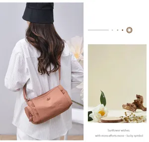 Detailed view of the stylish multi-pocket women shoulder bag in pink brown casual style.