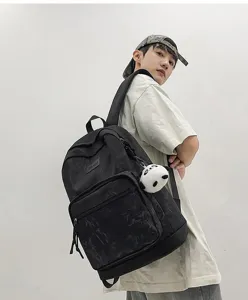 Stylish large capacity black printed backpack detail, ideal student school bag daily use.
