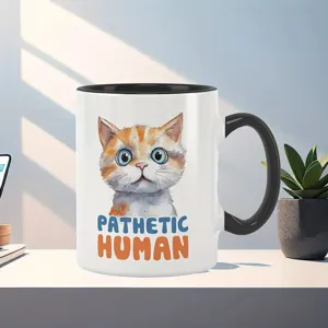 Ceramic coffee mug detail shot, featuring cute cat illustration and funny text design.
