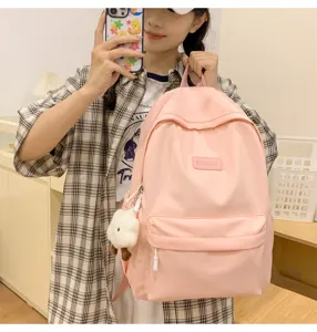 Pink minimalist large capacity casual backpack for women and students with plush pendant
