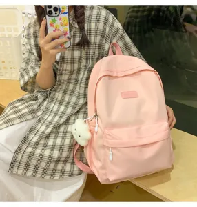 Casual pink minimalist backpack detail, large capacity school bag with cute cloud pendant.