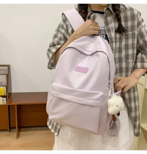 Casual minimalist large capacity solid color school backpack with cute fluffy sheep pendant detail
