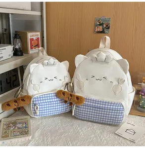 Cute Korean style white canvas backpack with blue plaid pocket, lovely cat ears design and plush toy.